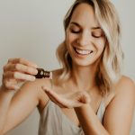 image_fx_a_blonde_happy_woman_holding_an_essential_oil